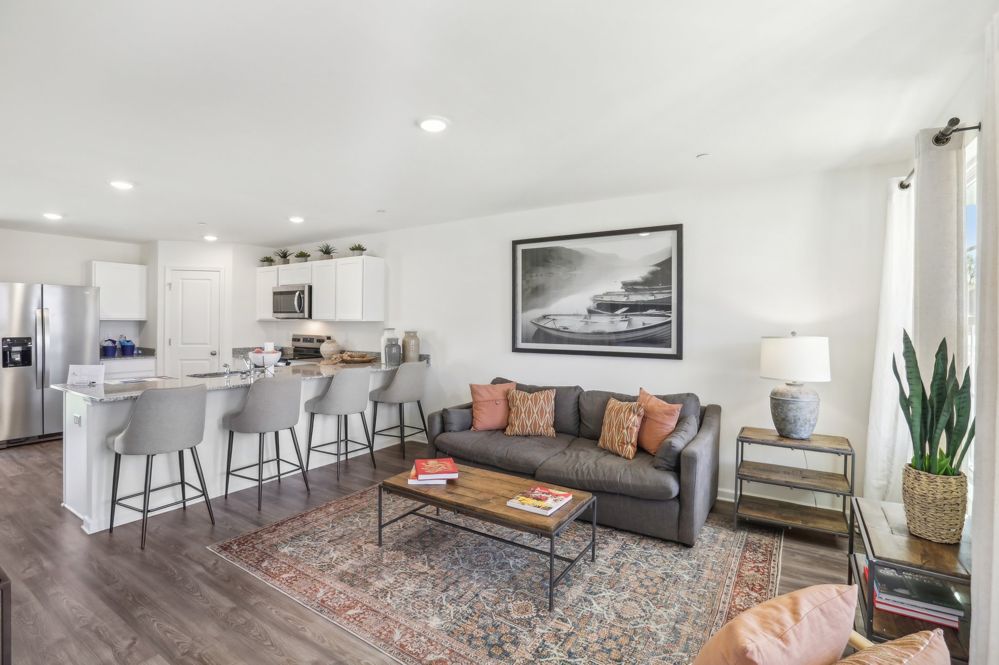 A living room with a couch and a table.
