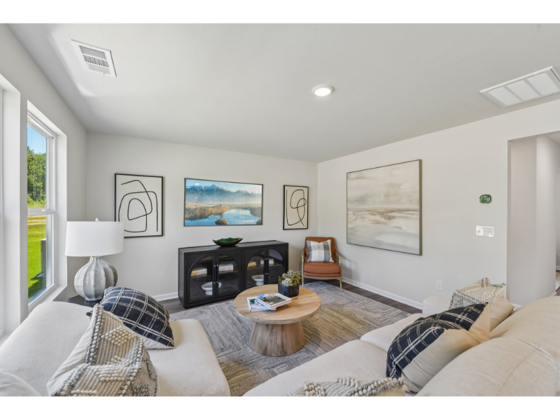 A living room with a couch and a coffee table.