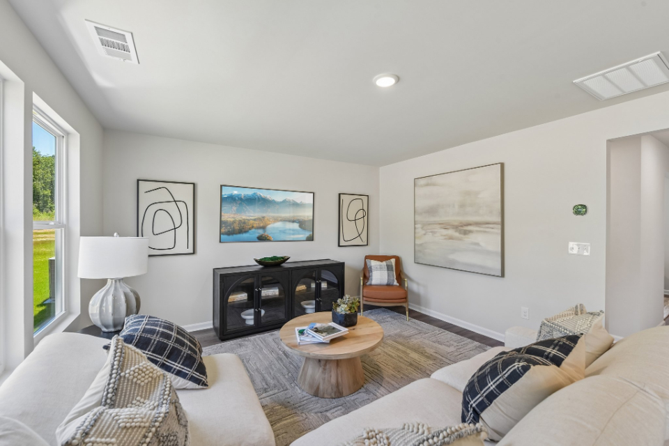 A living room with a couch and a coffee table.