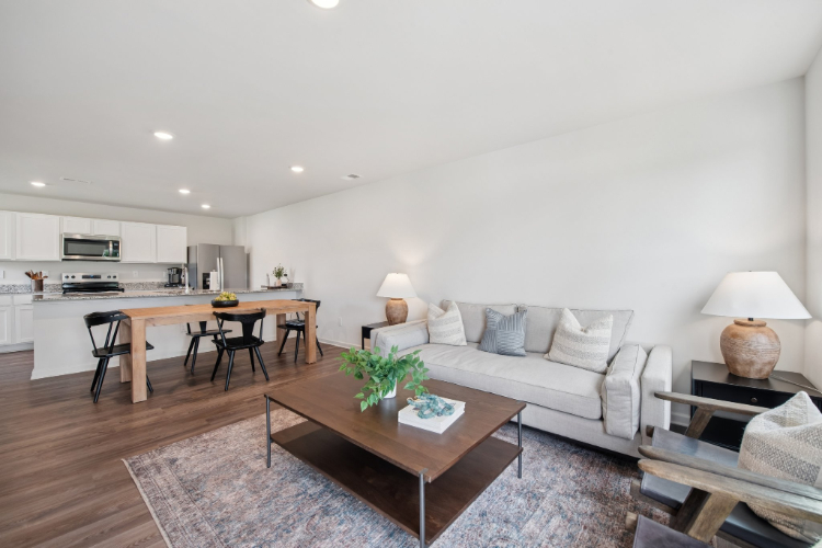 A living room with a couch and a table.