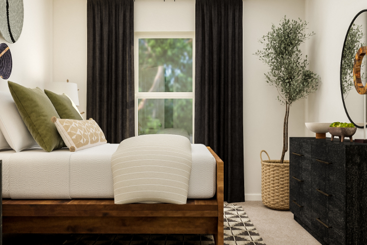 A white couch with pillows.