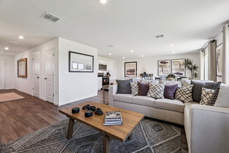 A living room with a couch and coffee table.