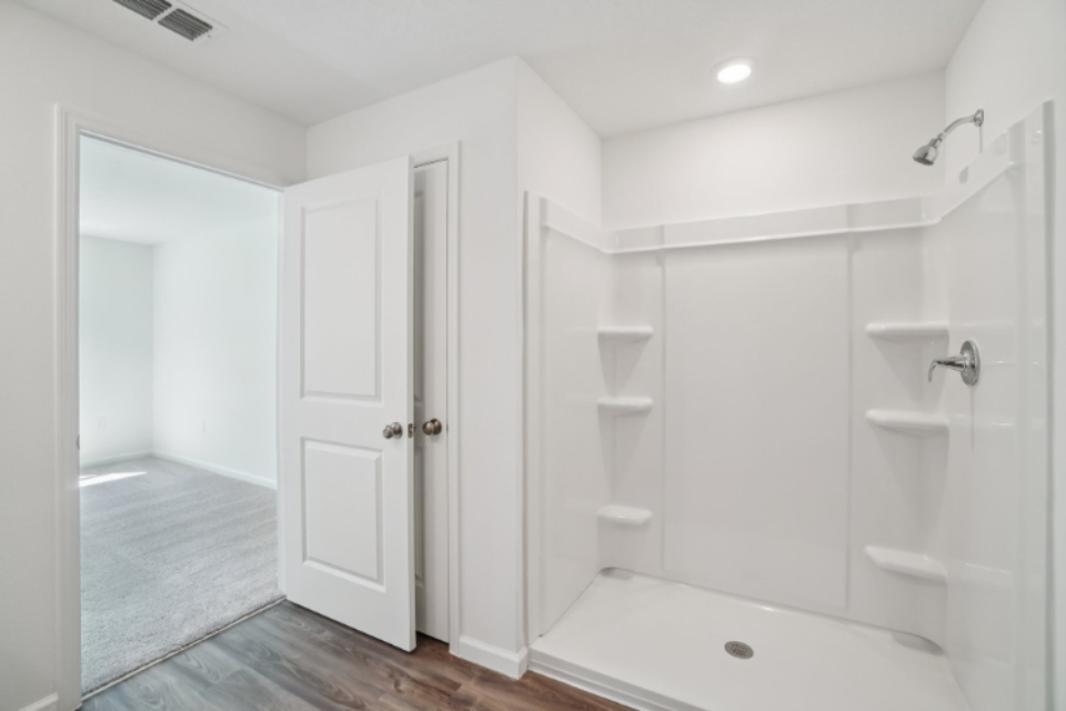 A bathroom with a tub and sink.