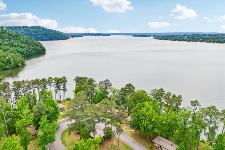 A body of water with trees around it.