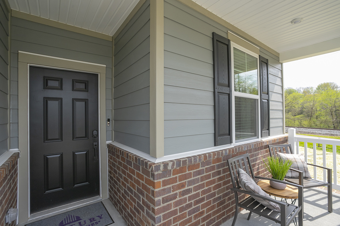 A patio with a table and chairs.