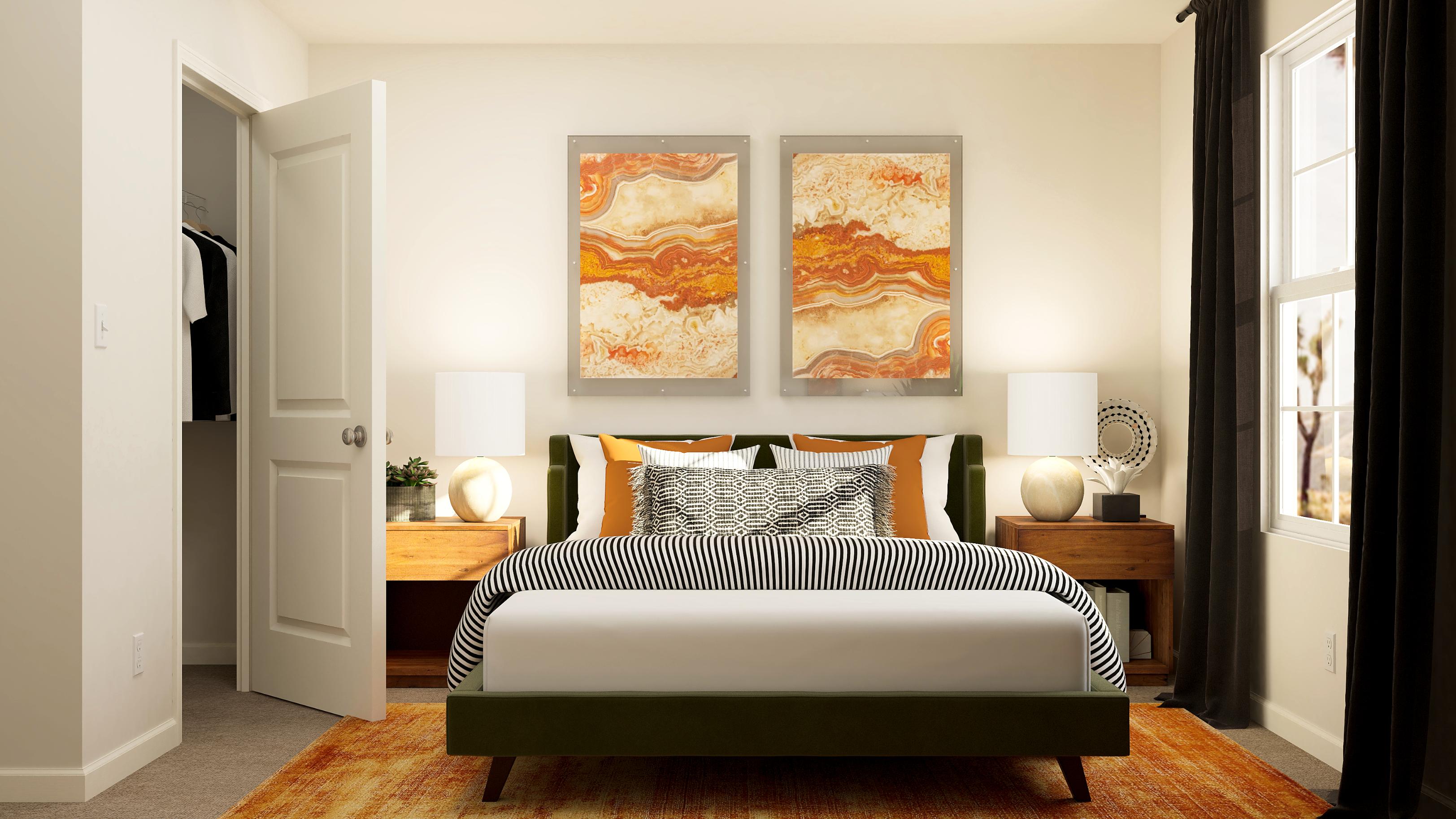 A bedroom with a bed and a lamp.