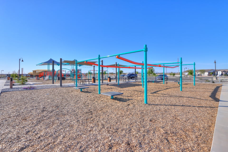A playground with blue and yellow bars.