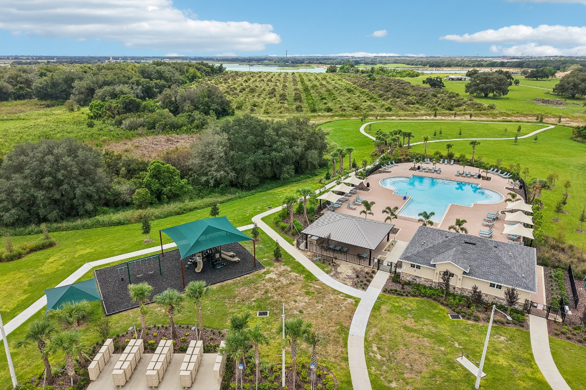A large backyard with a pool.
