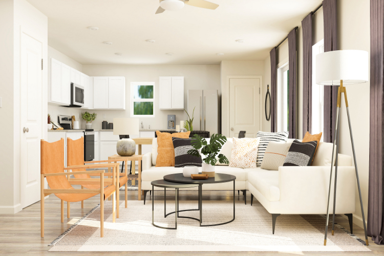 A living room with a white couch and a table.