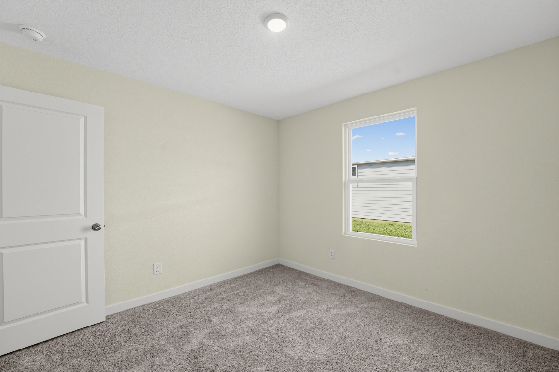 A room with a door and a window.