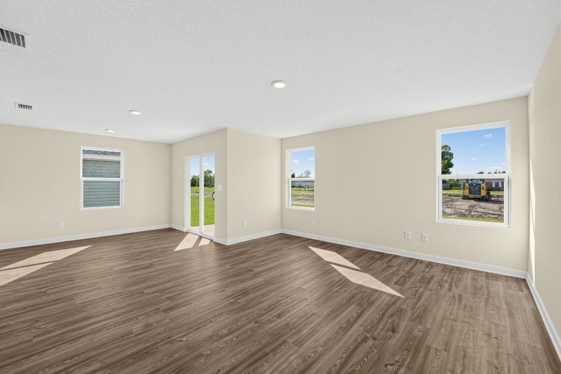 A room with a wood floor and a wood floor with a painting on the wall.