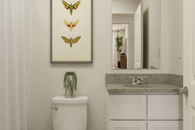 A bathroom with a marble countertop.