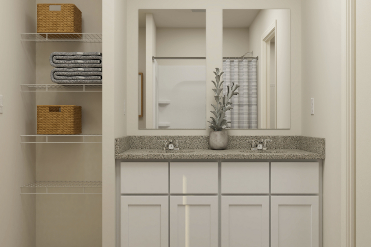 A bathroom with a large mirror.
