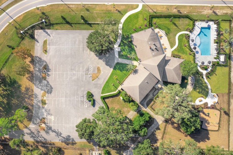 A large building with a parking lot.