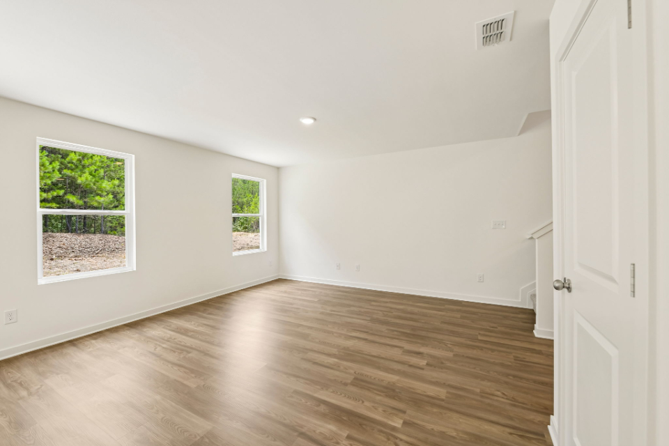 A room with a wood floor and a wood floor.