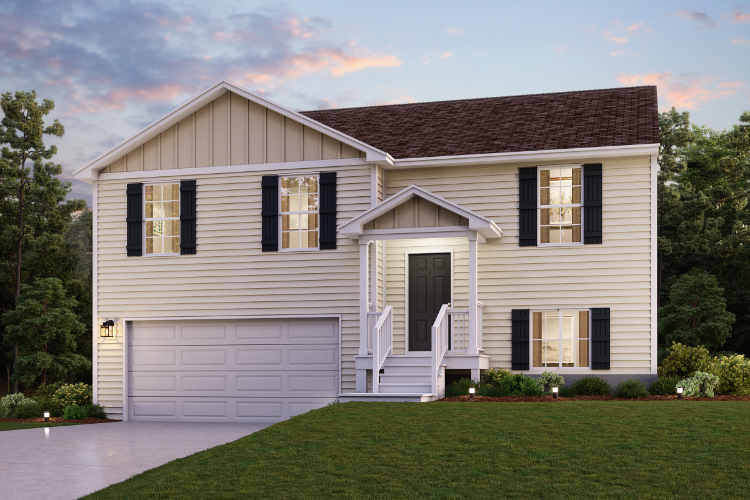 A white house with a green lawn.