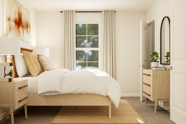 A bedroom with a bed and a dresser.