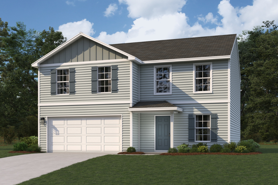 A white house with a garage.