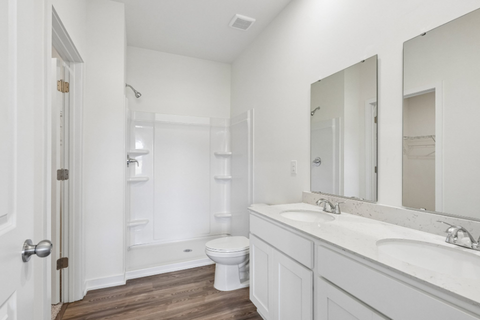 A bathroom with a toilet and sink.