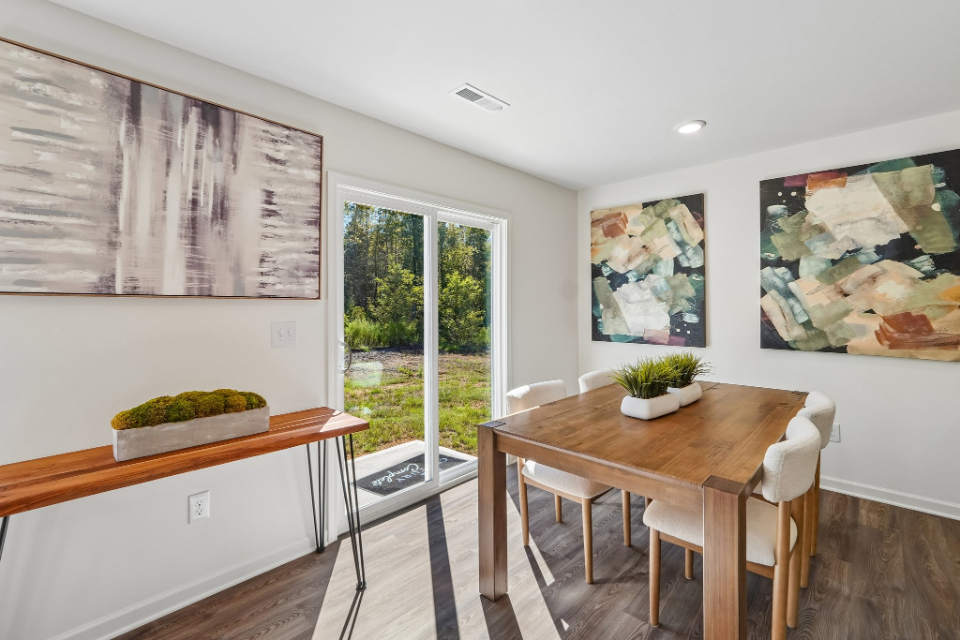 A room with a table and chairs.
