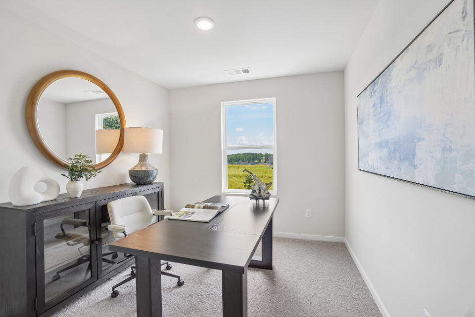 A room with a table and chairs.
