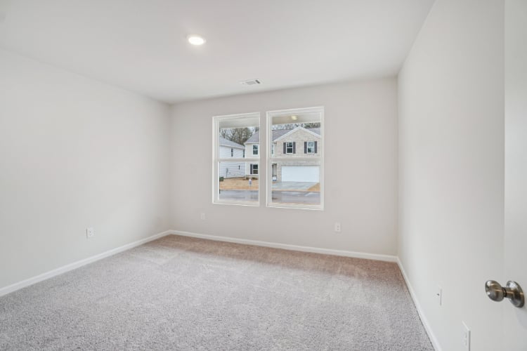 A room with a window and a door.