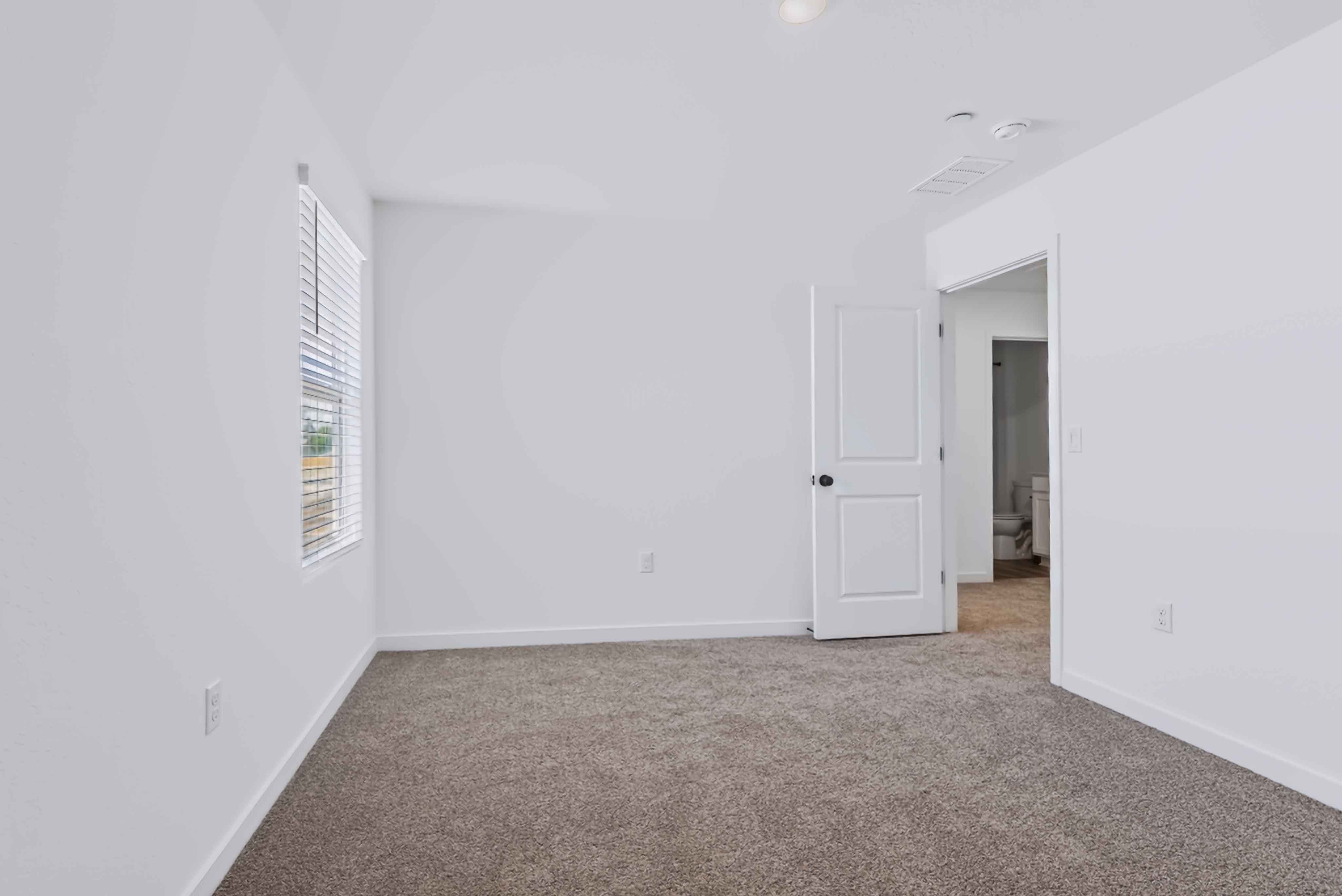 A hallway with white walls.