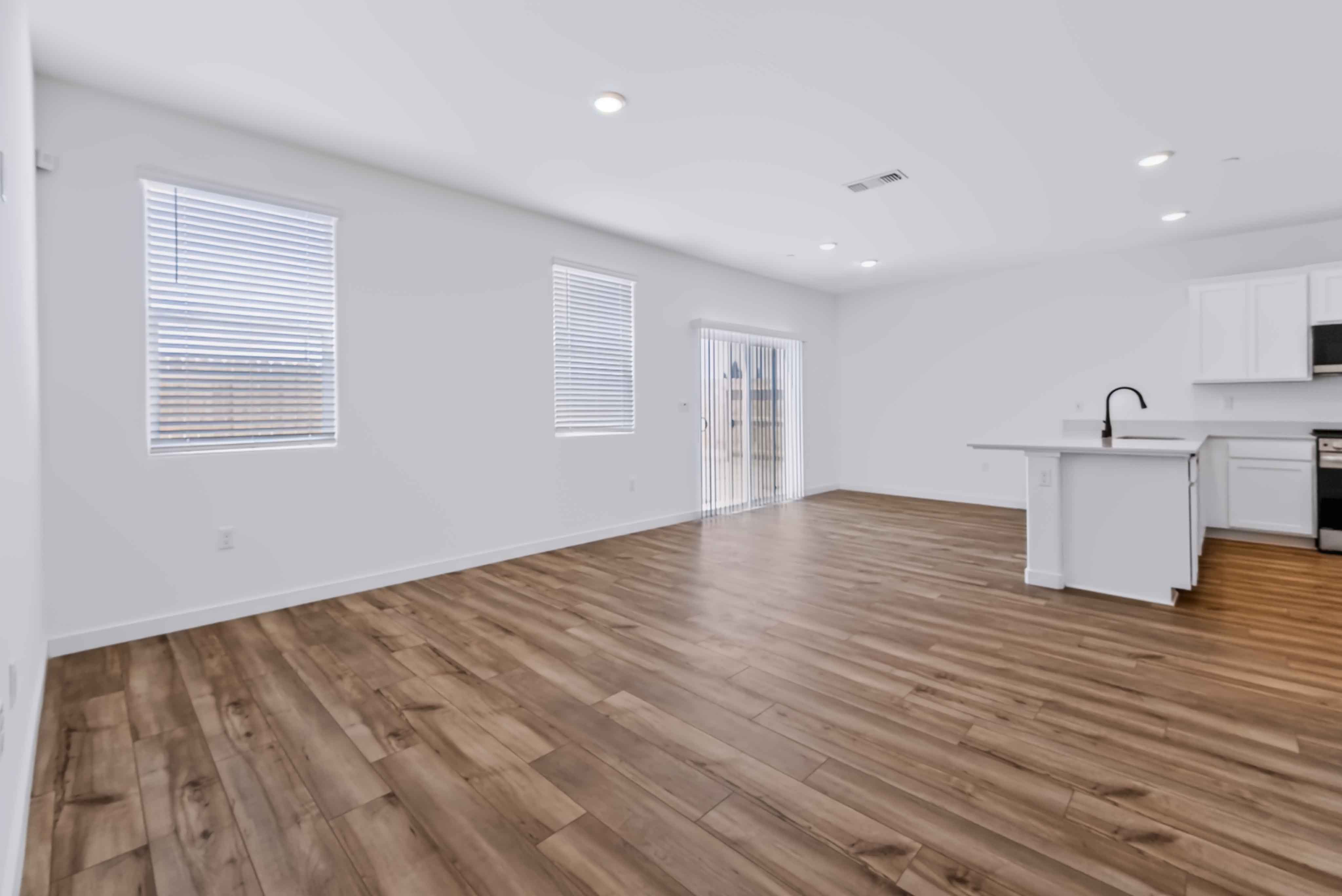 A kitchen with wooden floors.