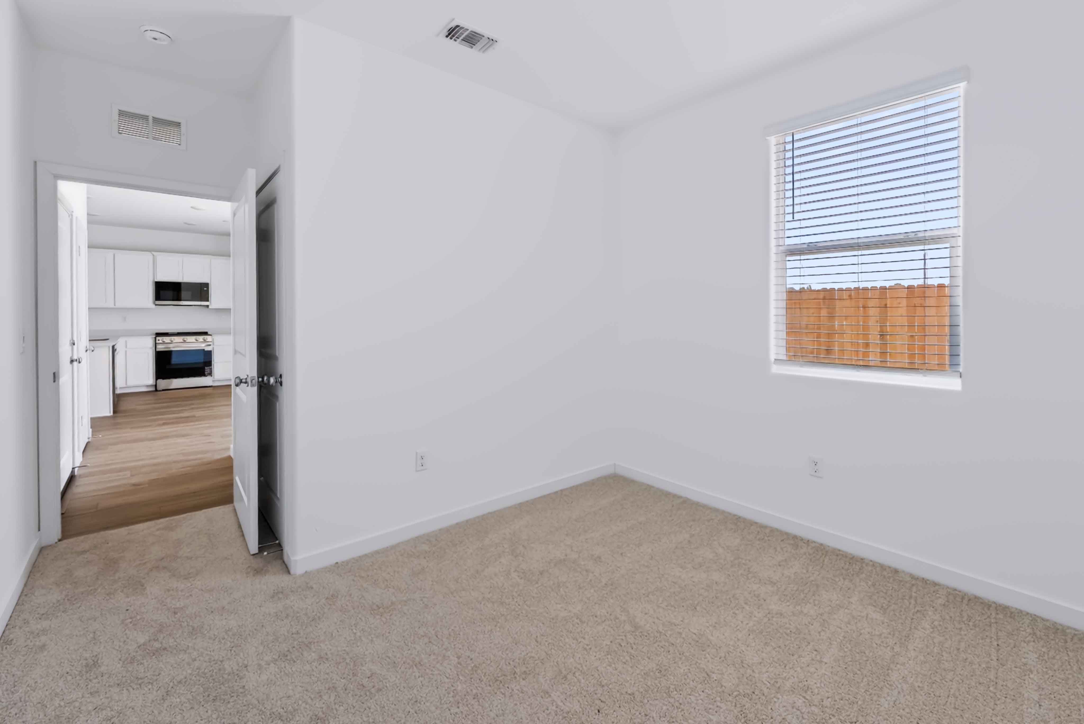 A room with a door and a window.