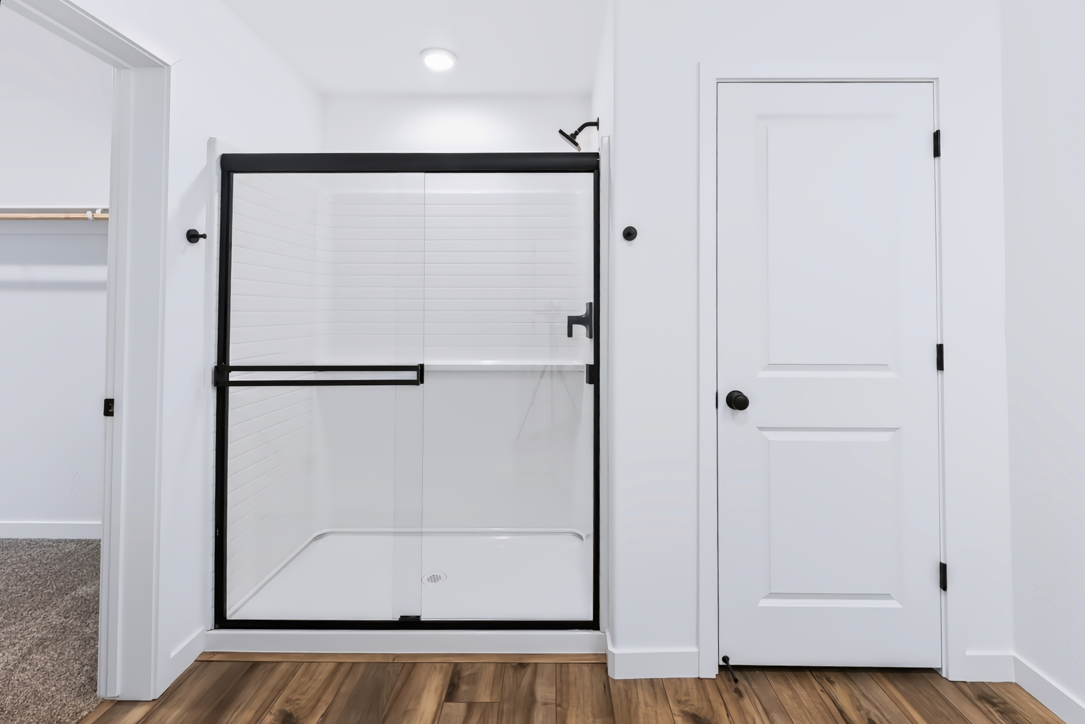 A white cabinet with a door.