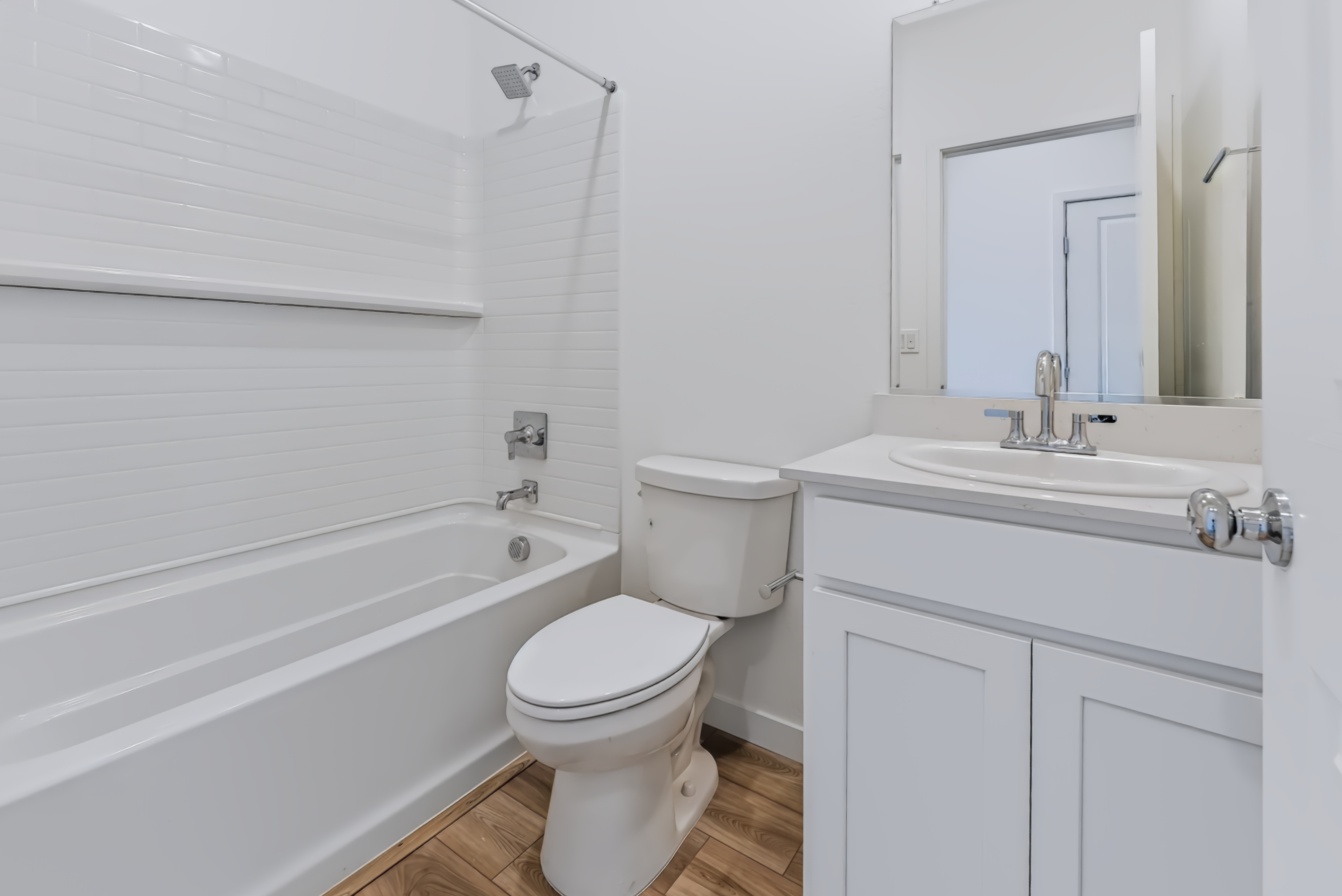 A bathroom with a toilet and sink.