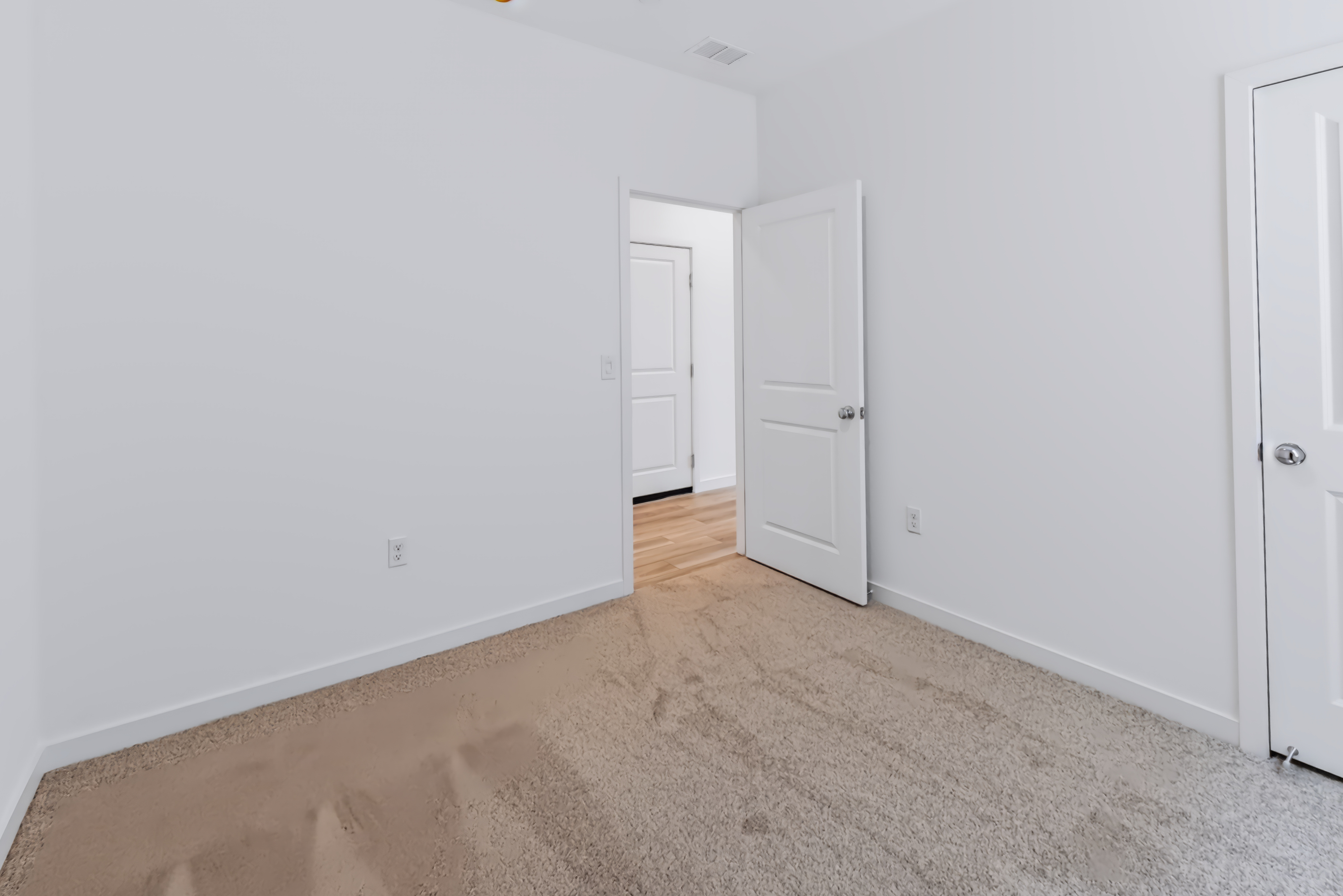 A room with white doors.