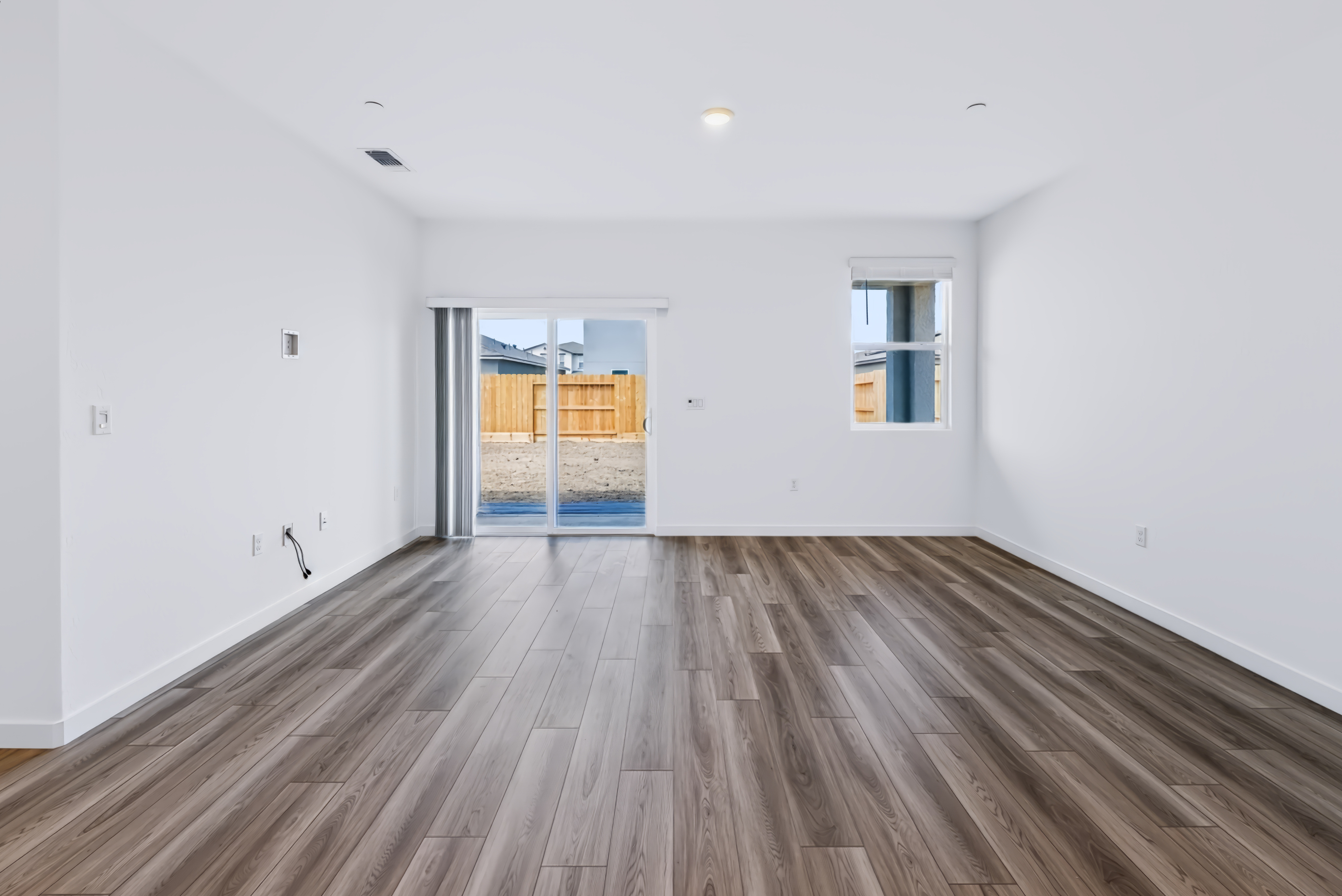 A room with a wood floor and a wood floor with a wood floor.