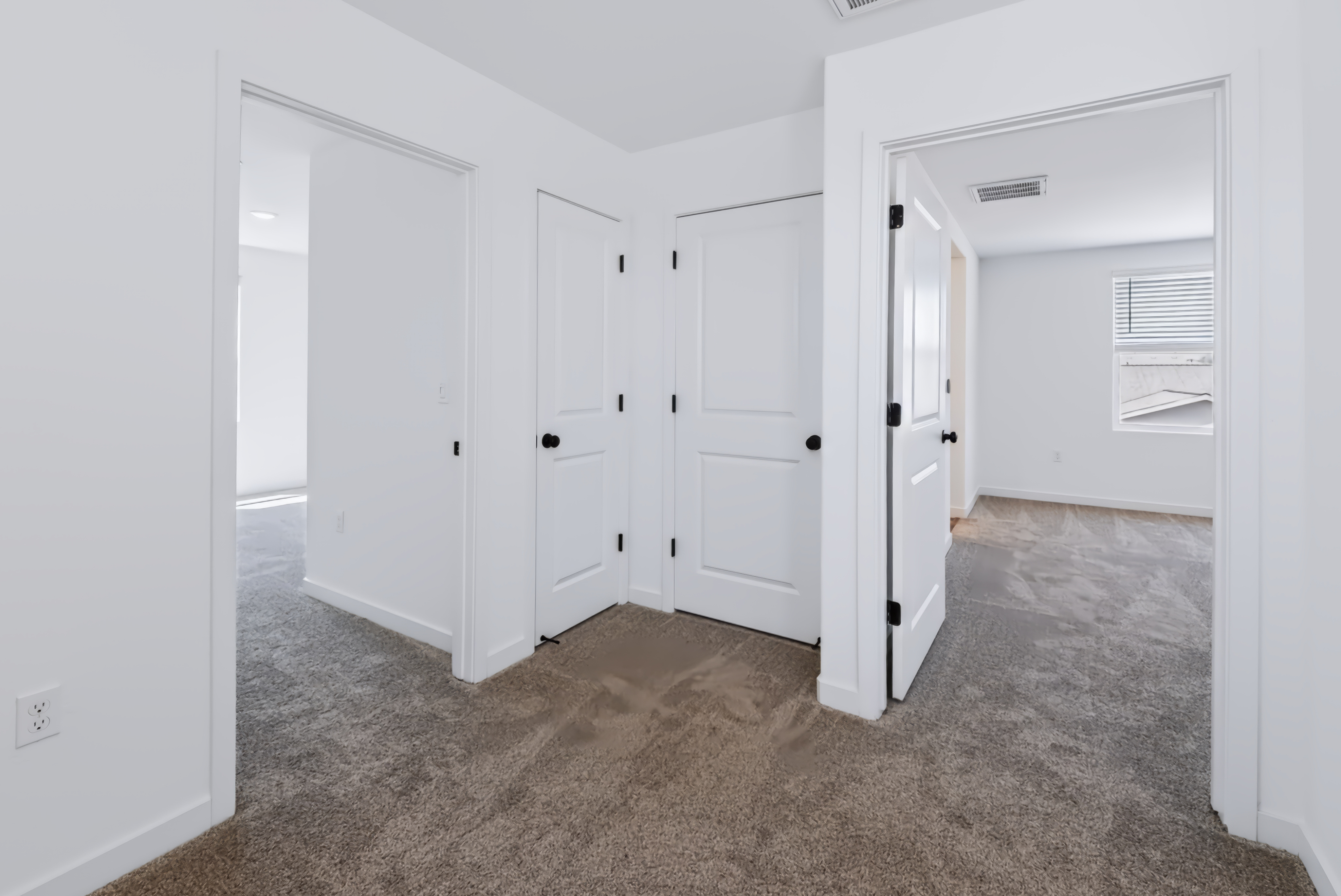 A room with white cabinets.