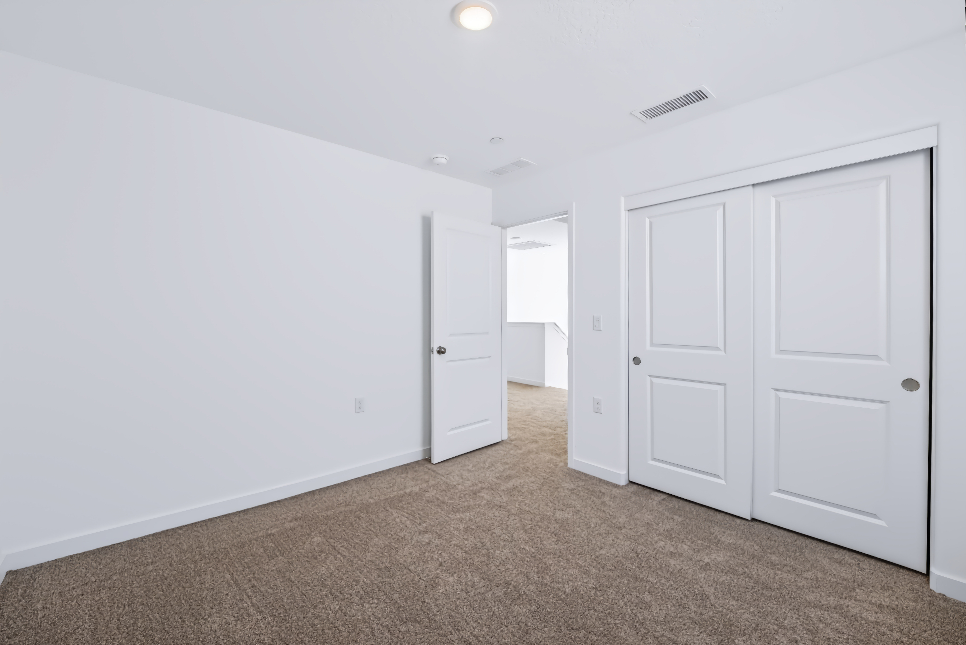 A room with white doors.