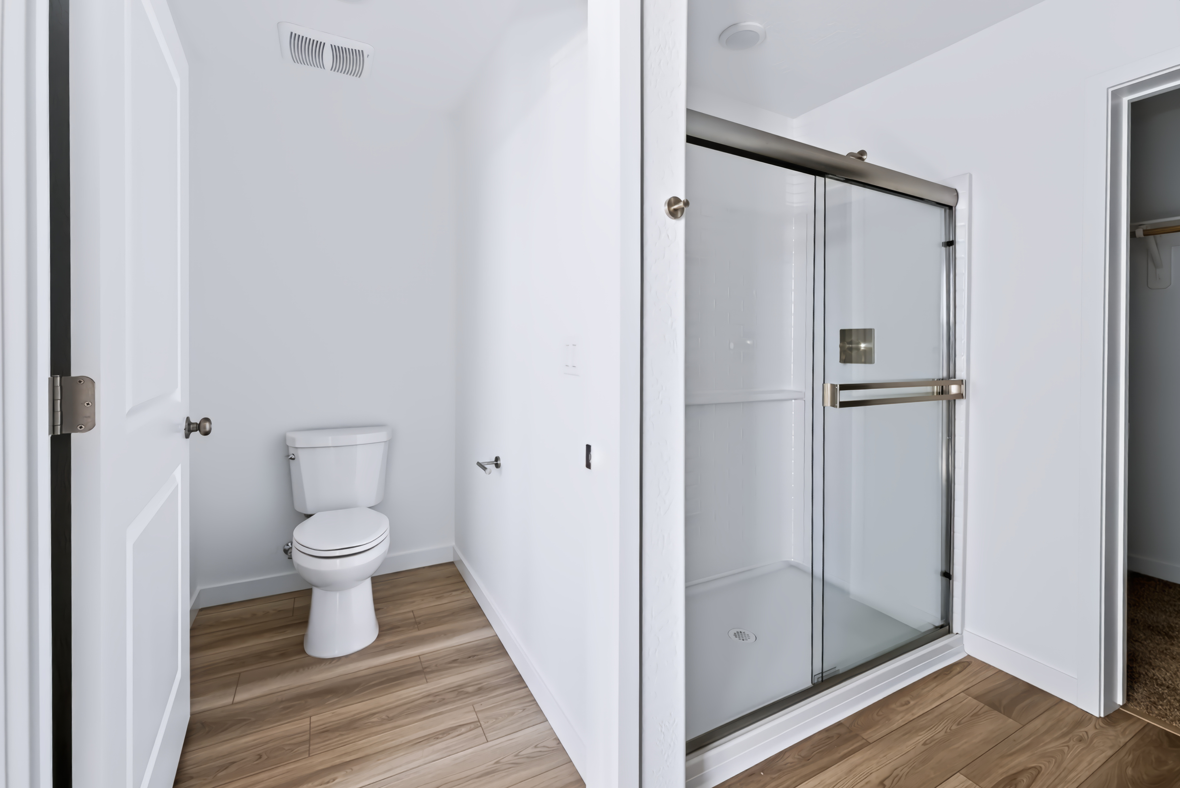 A bathroom with a glass shower.