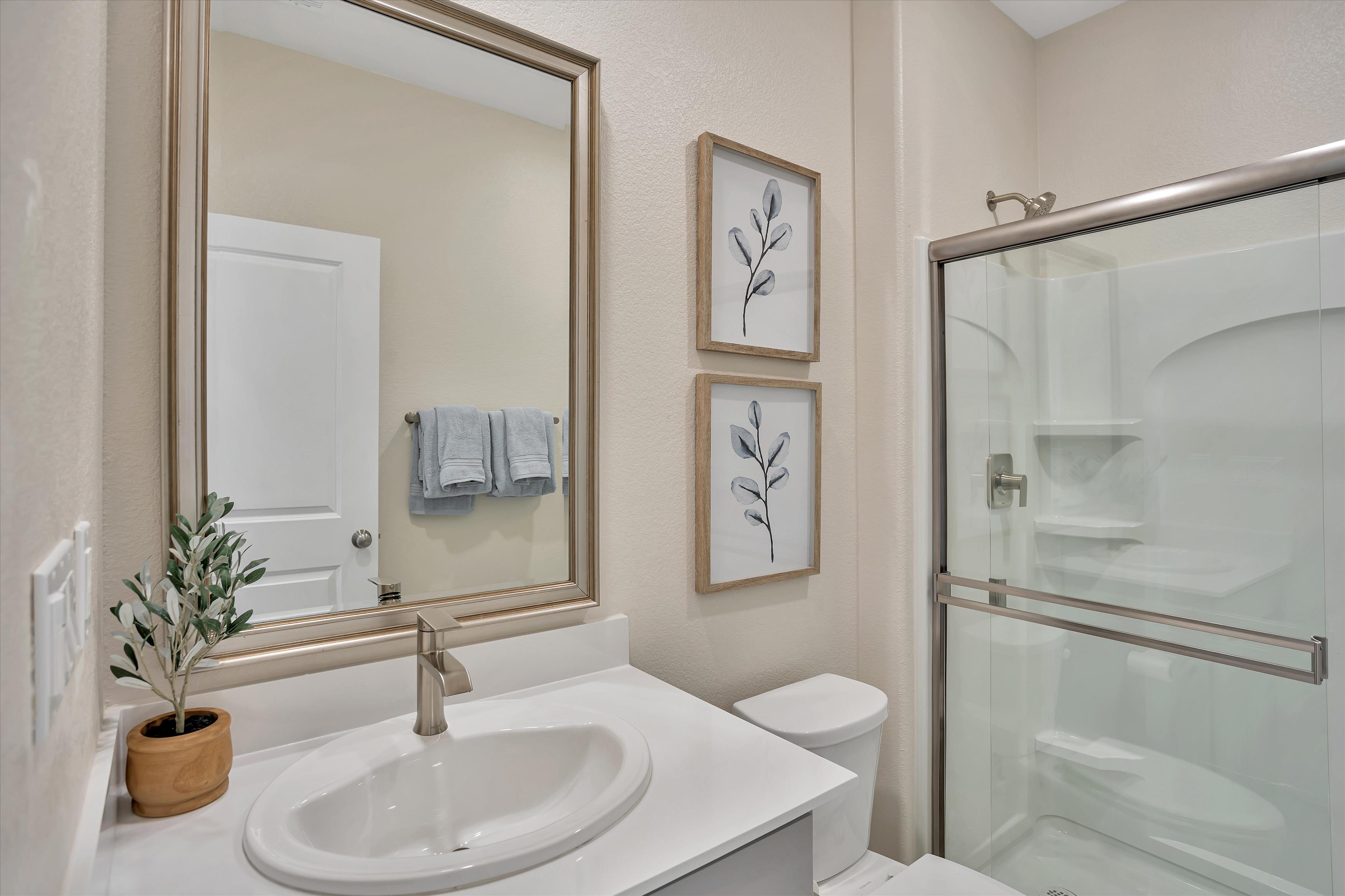 A bathroom with a glass shower.