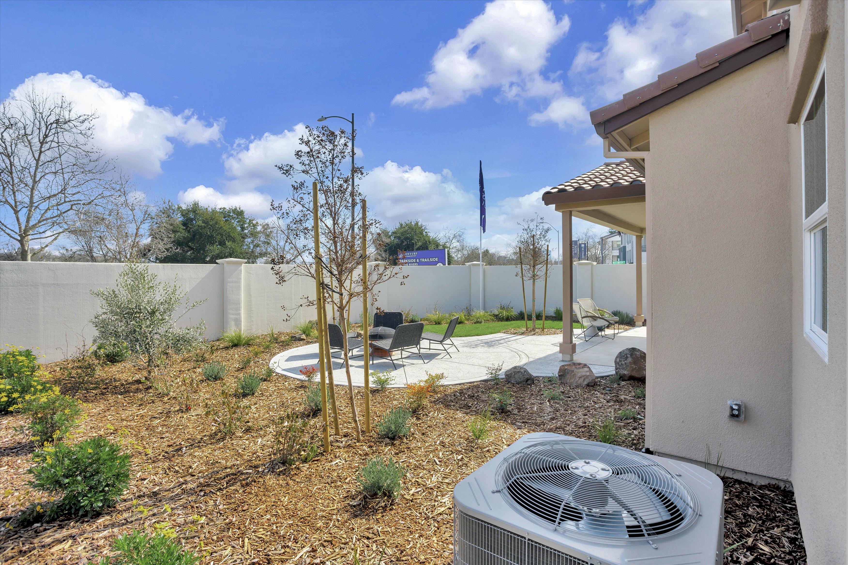 A backyard with a solar panel.