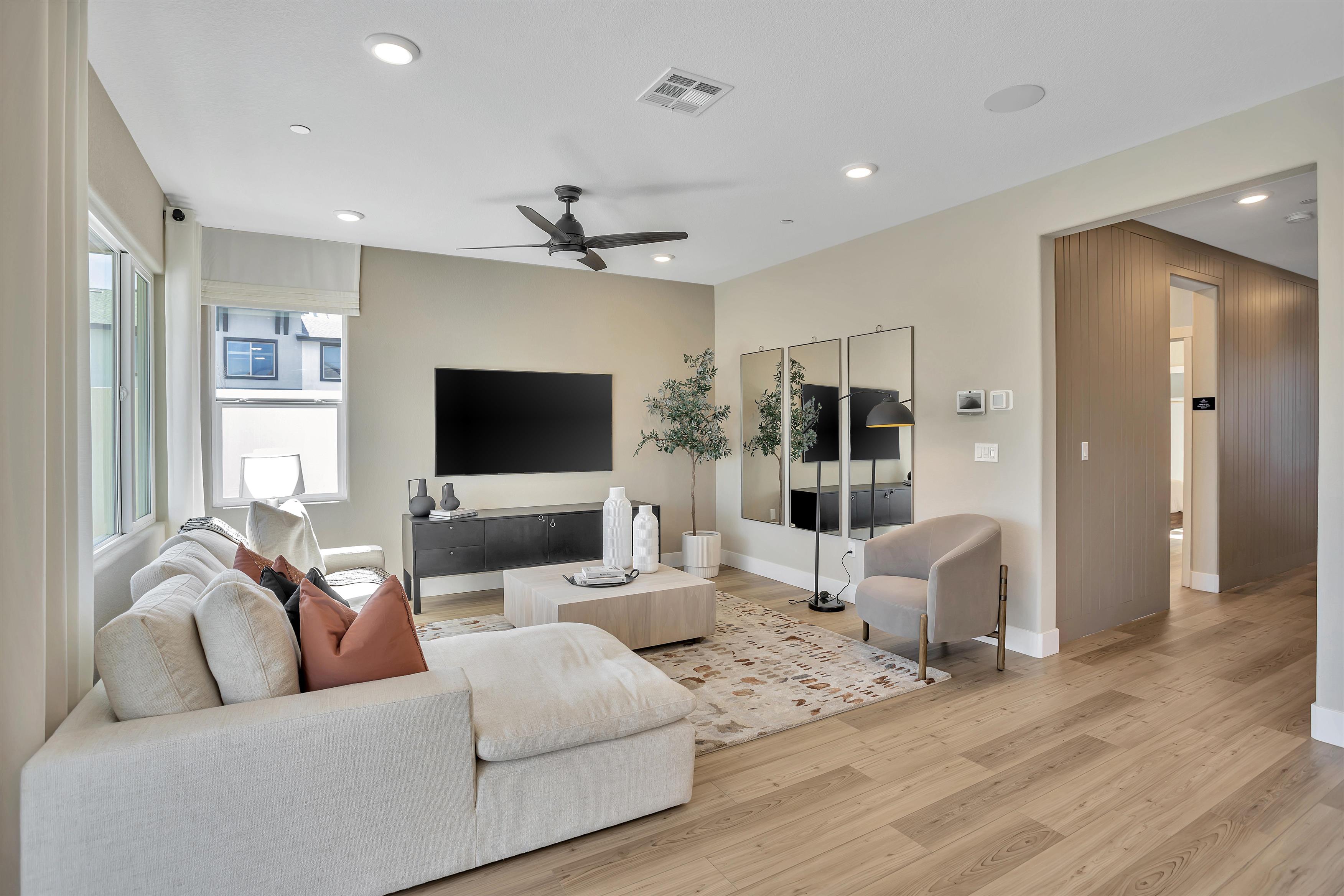 A living room with a wood floor.